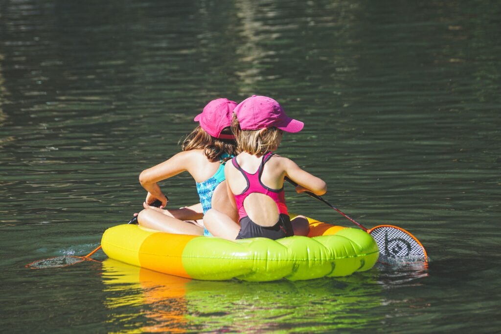 Girls floating together on an inflatable raft. California Boating Lakes