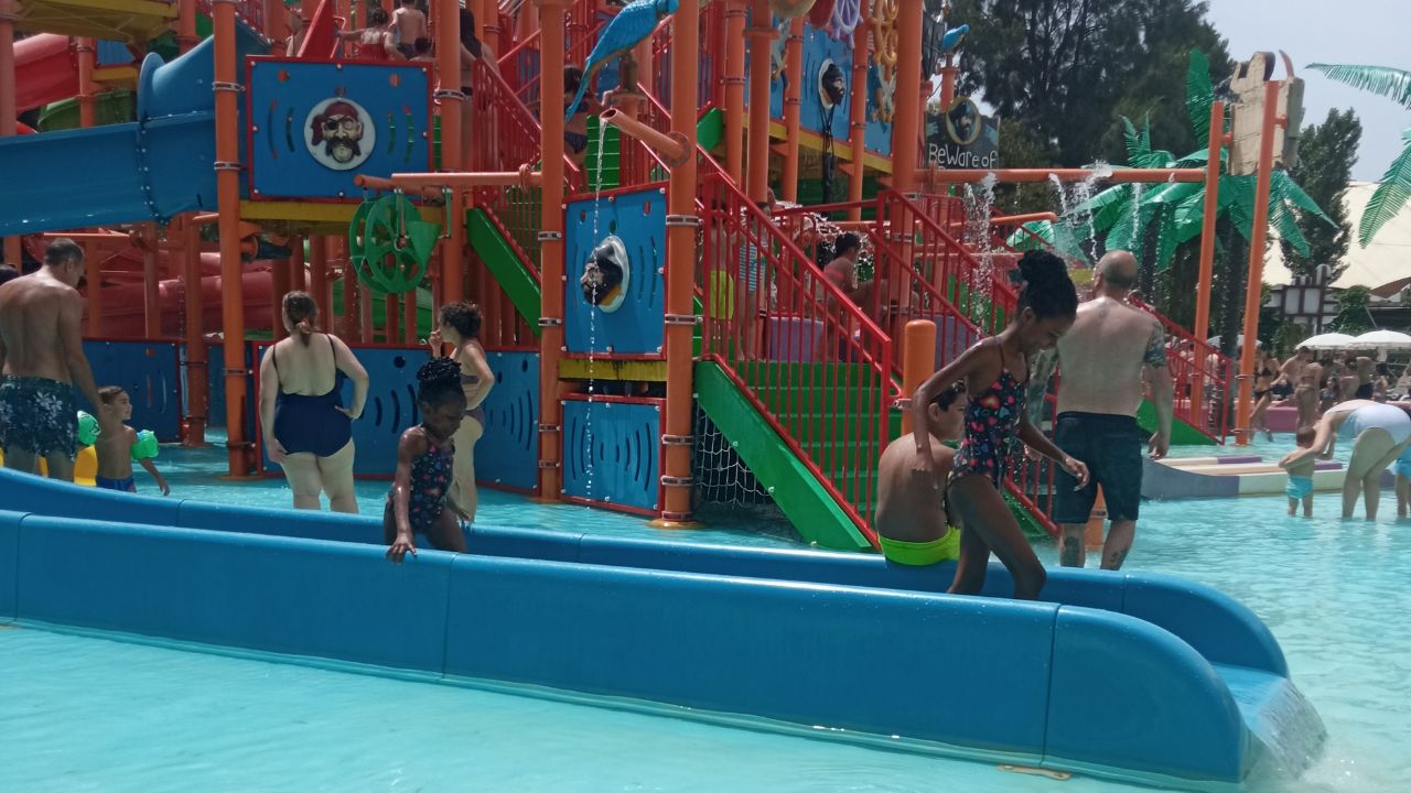 Children playing in a pirate-themed section of a water park in Rome