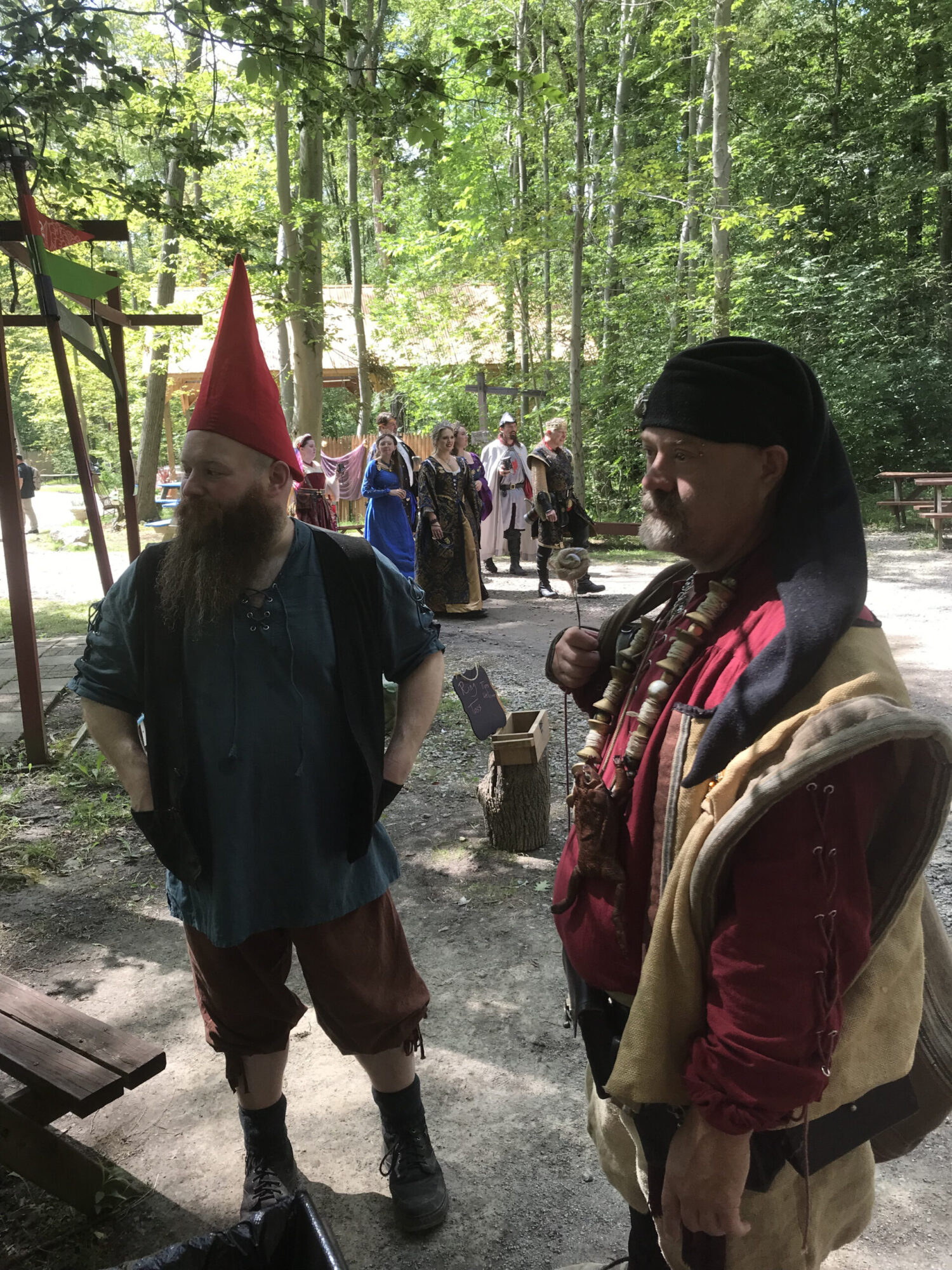 Faire goers in the woods of Avoloch. Great Lakes Medieval Faire. 
