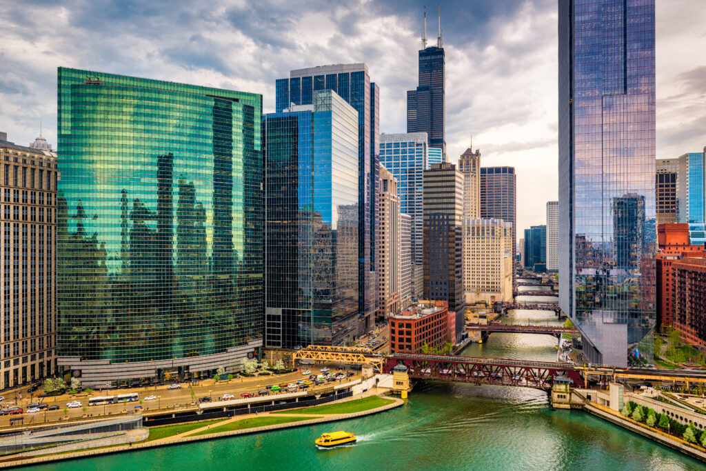 water taxi next to chicago skyscrappers