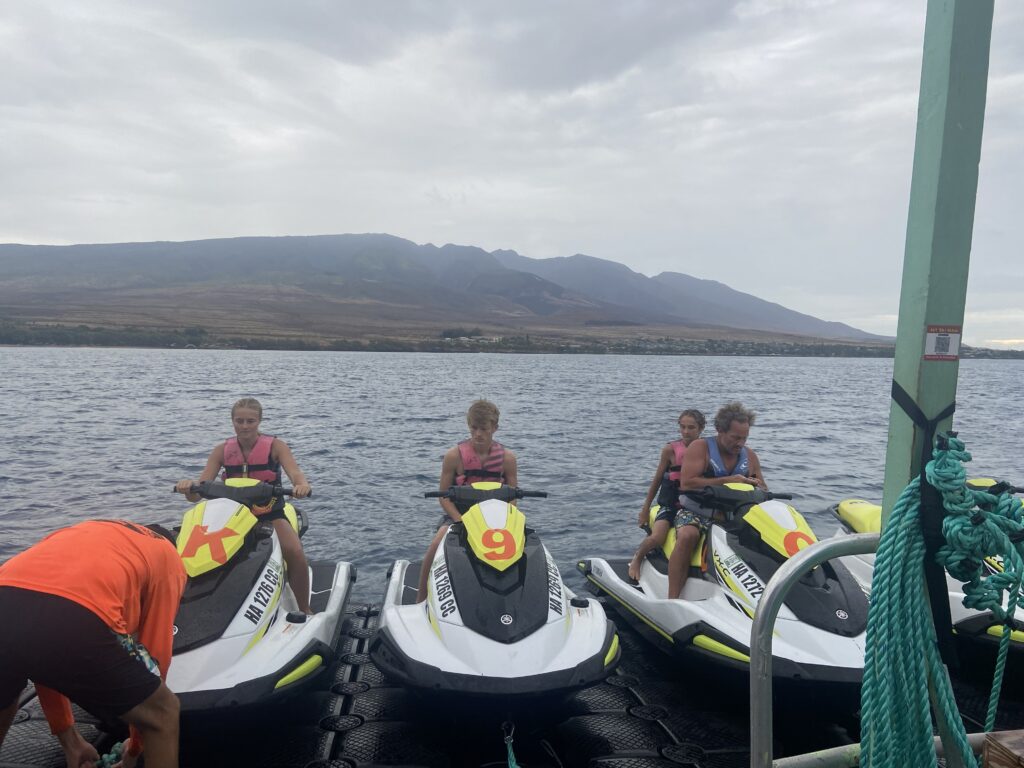 family with kids on wave runners.