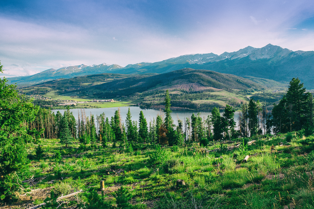 green mountain with river in background