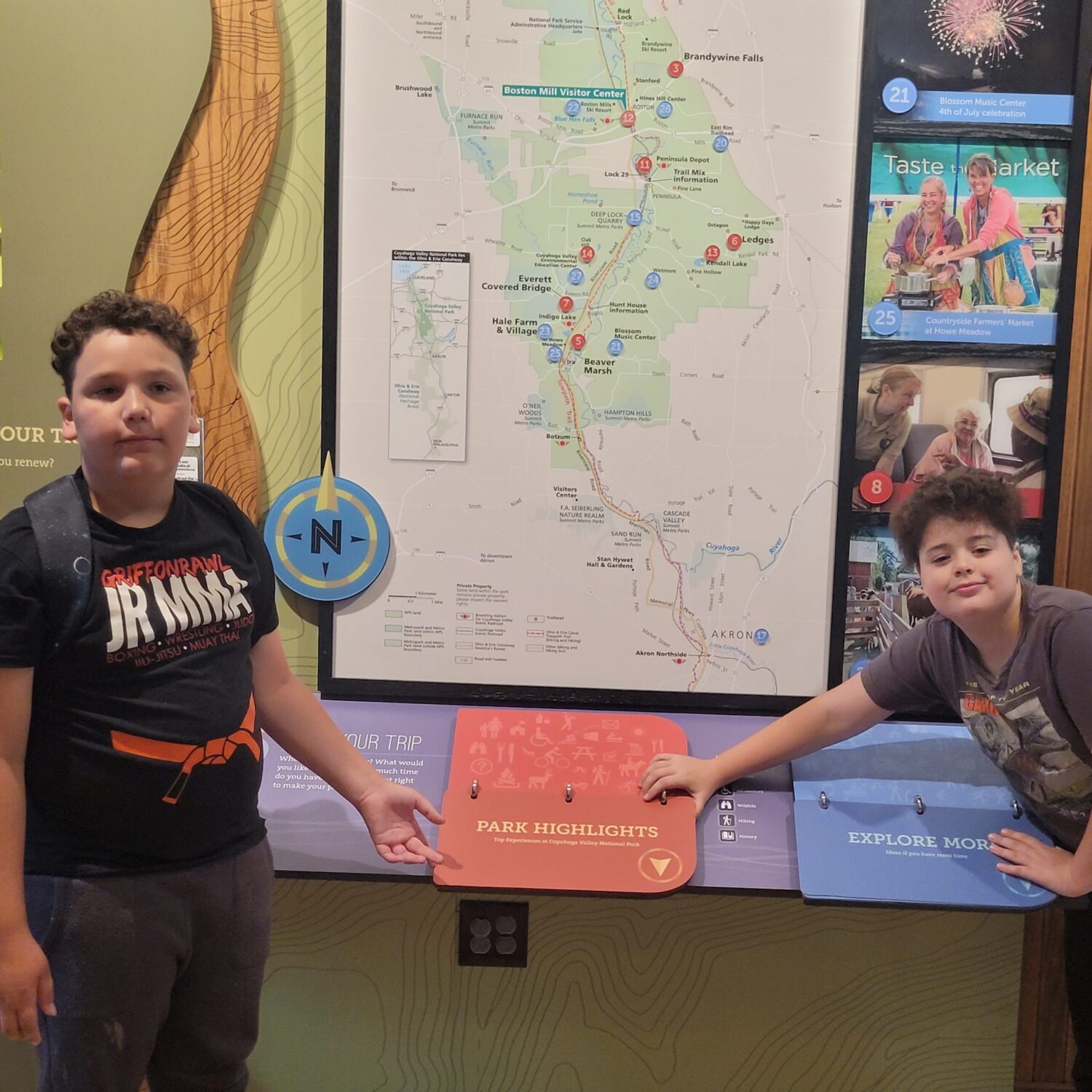 Boys standing in front of park map for Cuyahoga Valley National Park. CVNP for Families. 