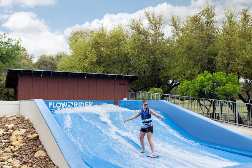 woman on a flowider surf simulator