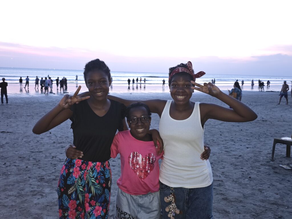 Three teens on the beach in Bali