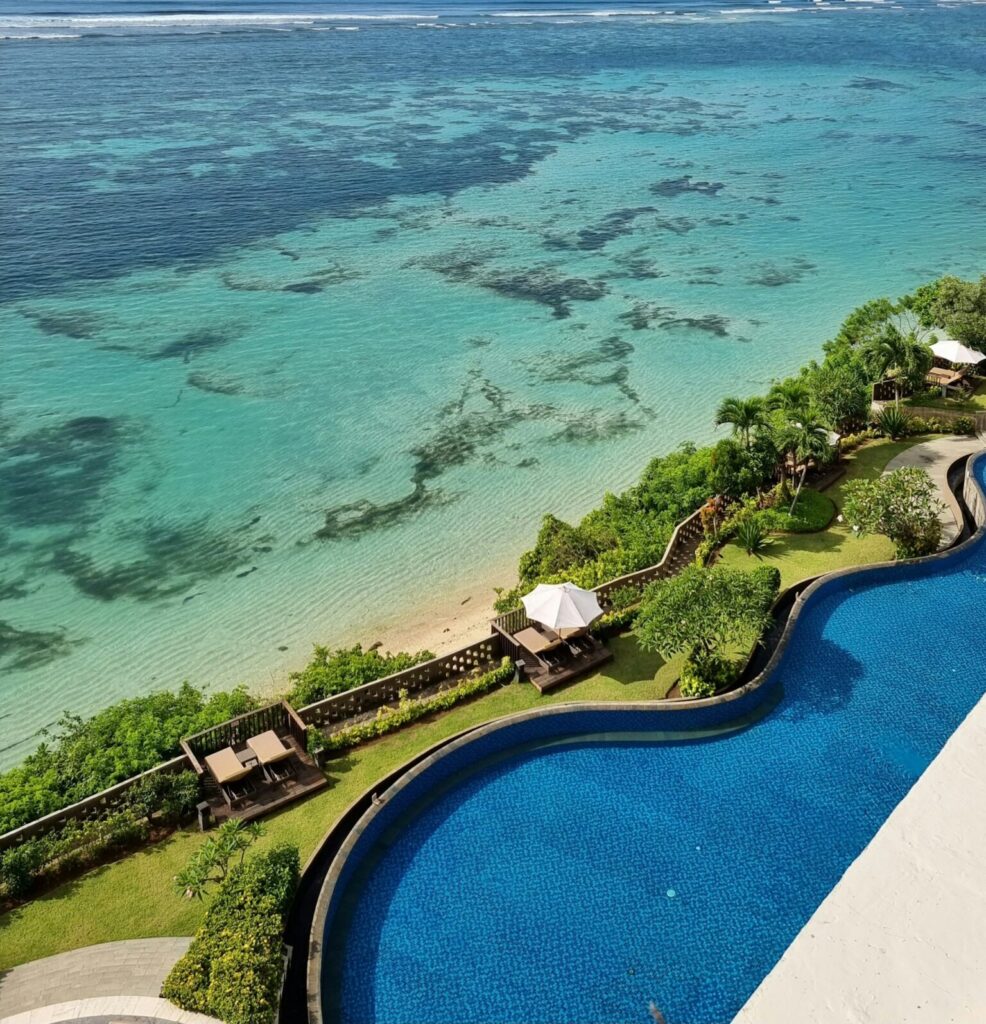 A view of the ocean from the top of a building